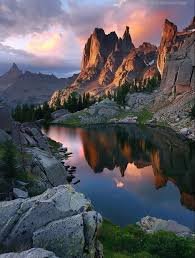 Cabinet Mountains reflected in a still alpine lake at sunset